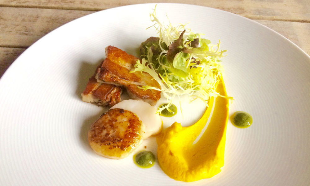 Confit Belly Pork, pan fried scallops, carrot and fennel puree with a cider mustard and sorrel dressing